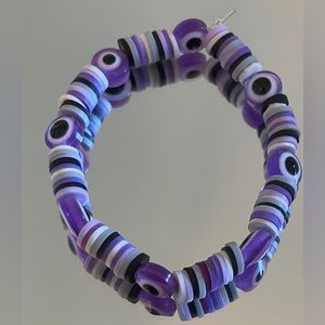 Handmade purple evil eye clay bead bracelet